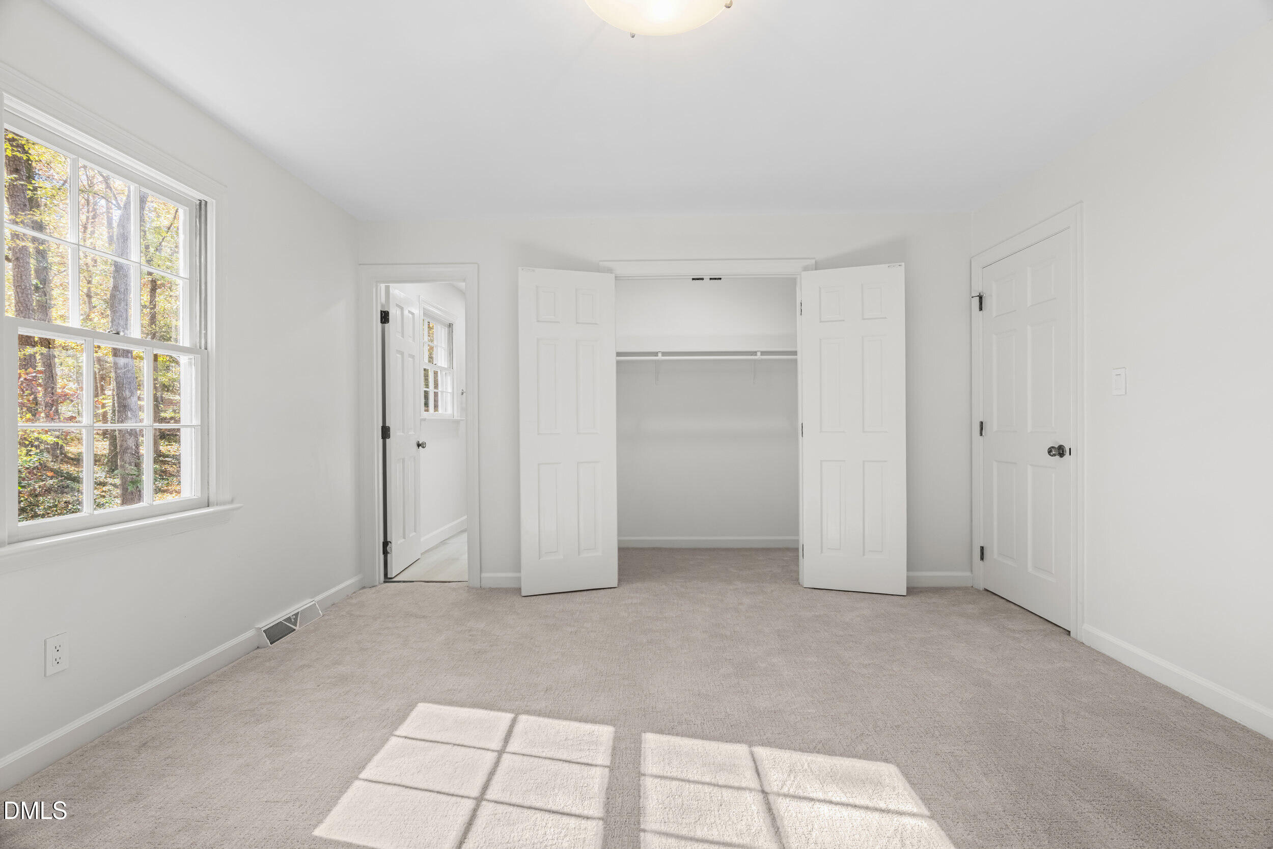 2105 Yorkgate Drive Raleigh, NC 27612 - Photo 20 of 42 a view of an empty room with a window