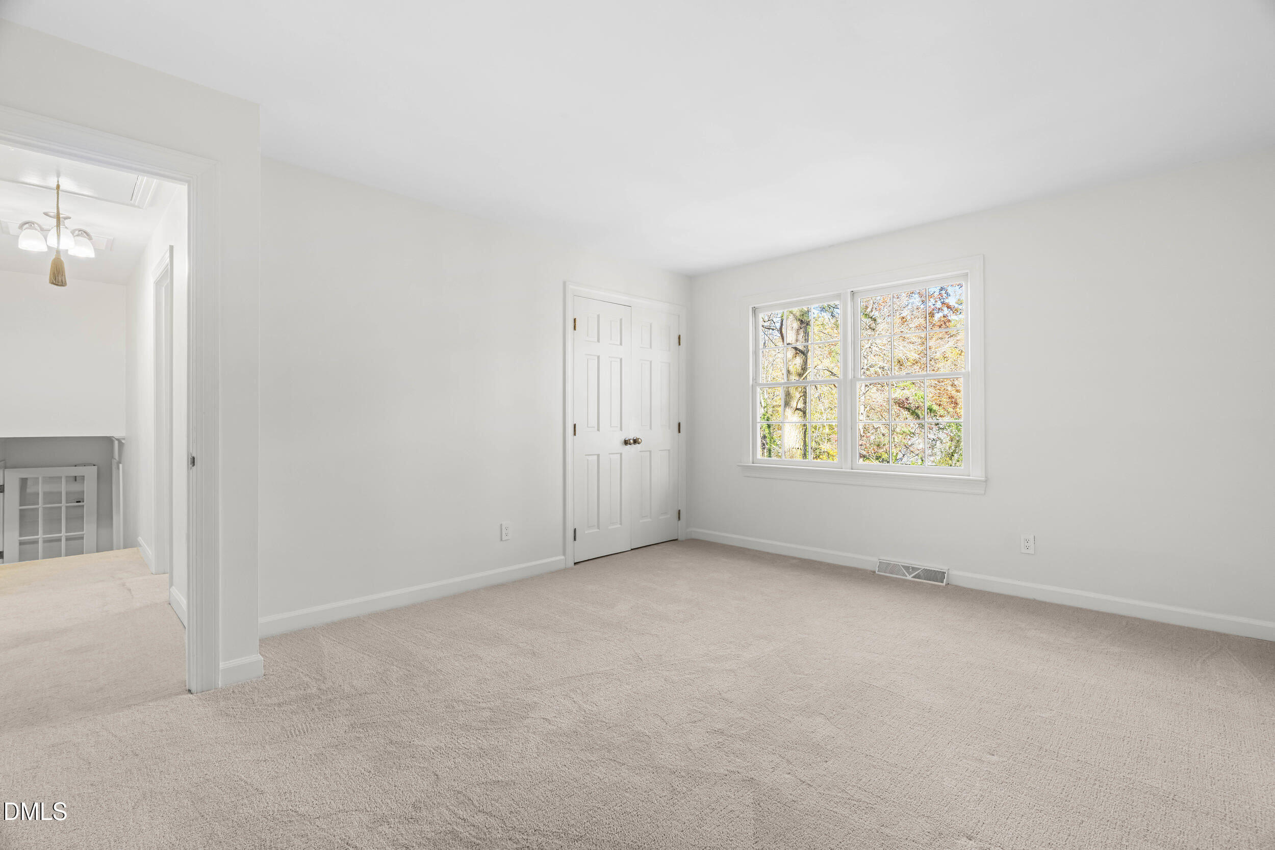 2105 Yorkgate Drive Raleigh, NC 27612 - Photo 24 of 42 an empty room with windows and closet