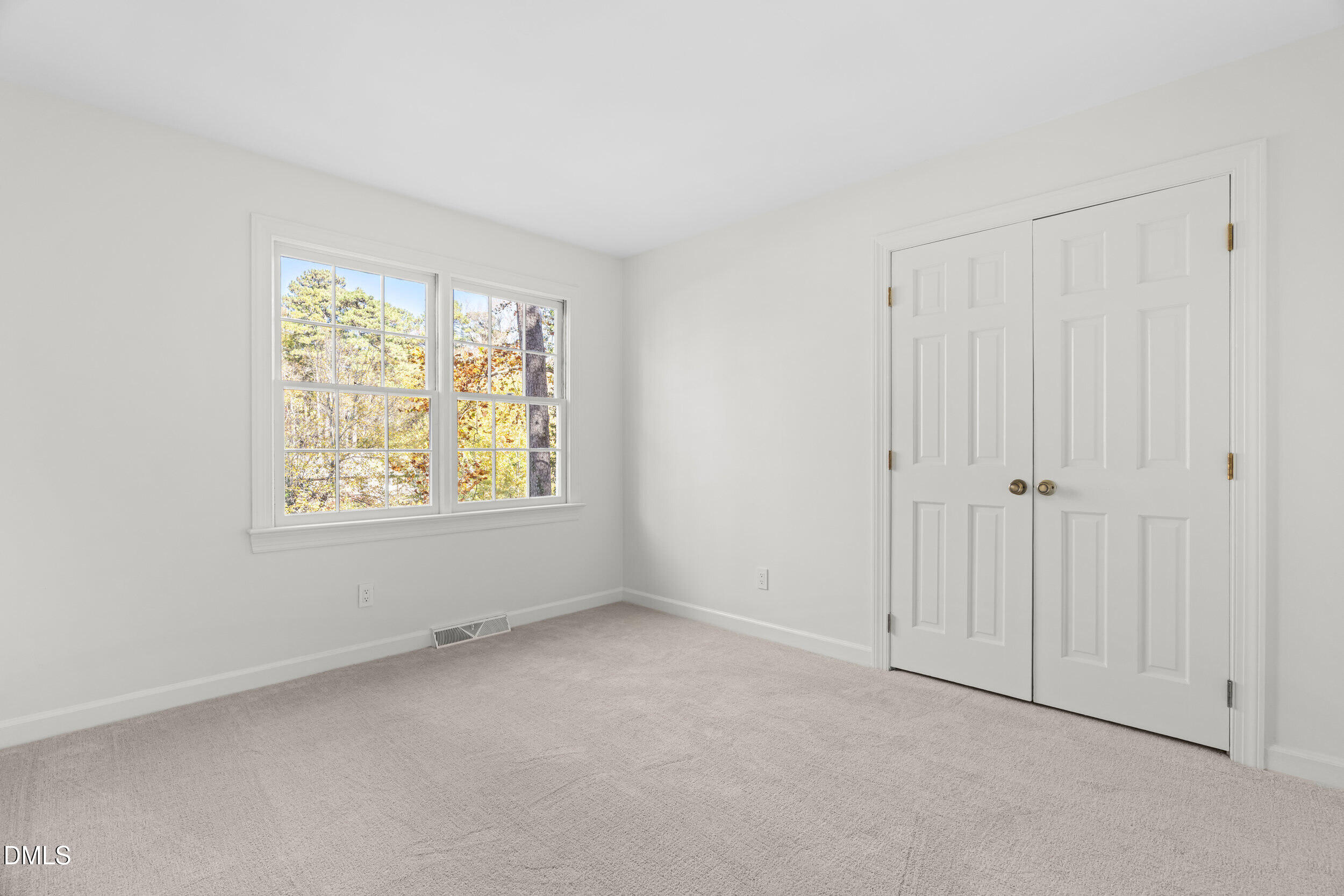 2105 Yorkgate Drive Raleigh, NC 27612 - Photo 25 of 42 a view of an empty room with a window