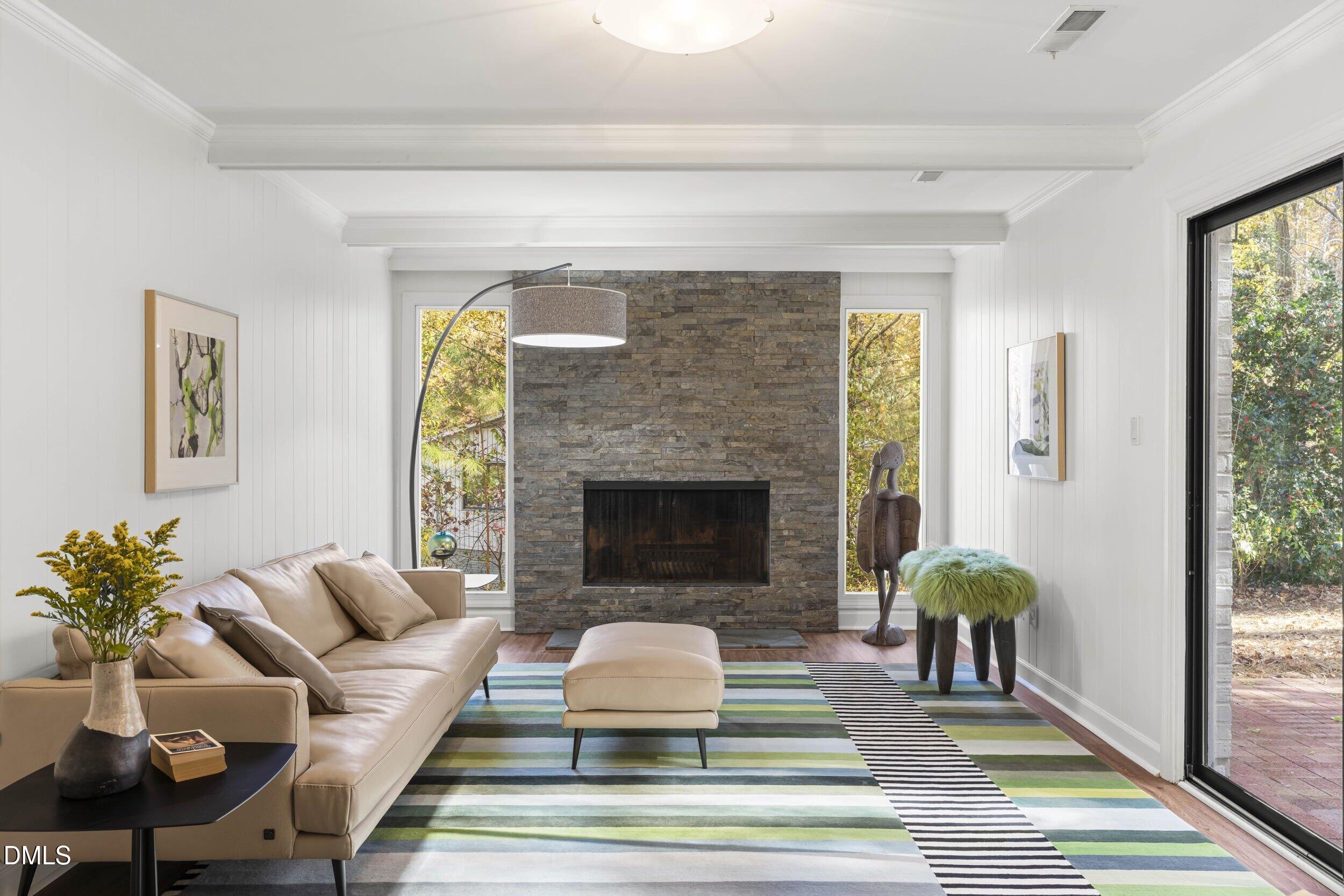 2105 Yorkgate Drive Raleigh, NC 27612 - Photo 26 of 42 a living room with furniture and a fireplace