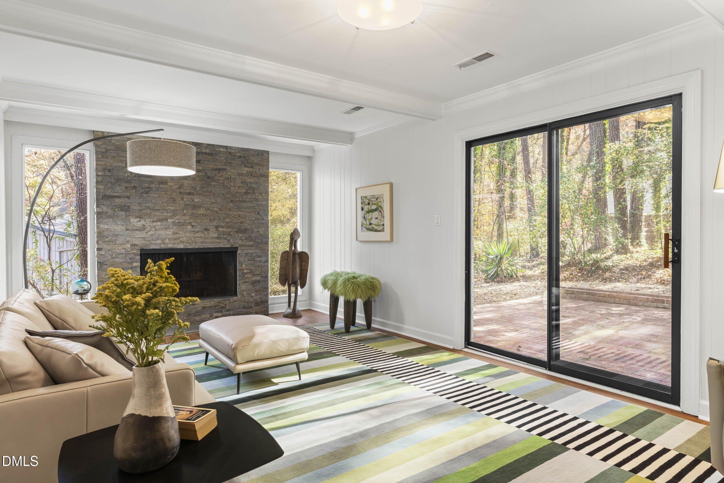 2105 Yorkgate Drive Raleigh, NC 27612 - Photo 28 of 42 a living room with furniture and a fireplace