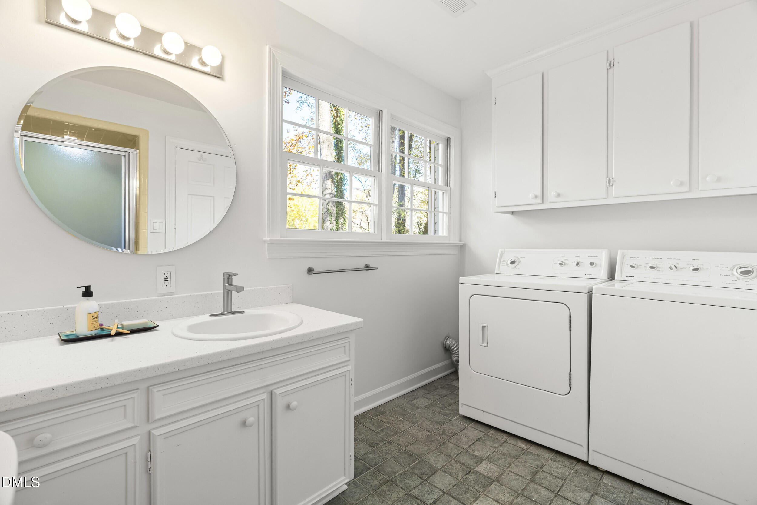 2105 Yorkgate Drive Raleigh, NC 27612 - Photo 33 of 42 a bathroom with a sink and a mirror