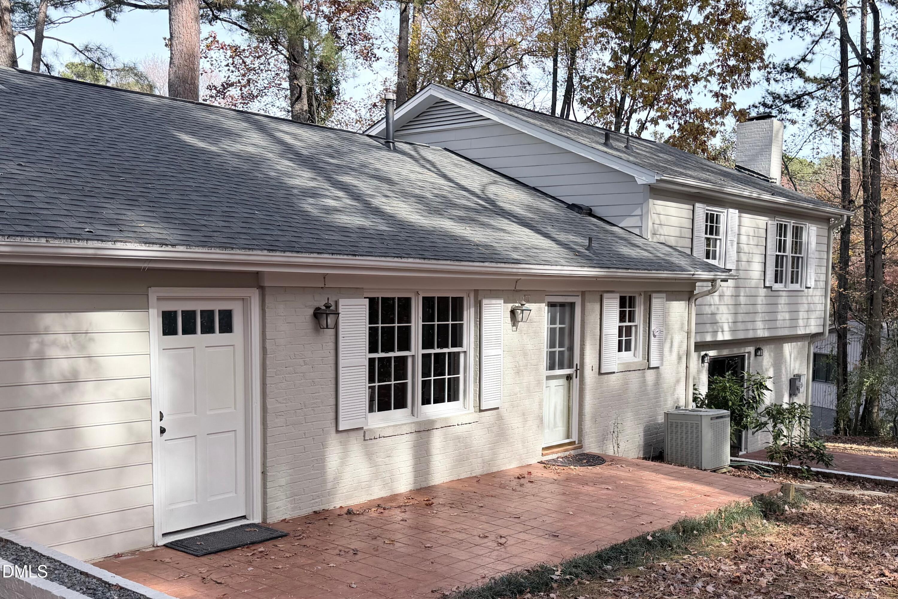2105 Yorkgate Drive Raleigh, NC 27612 - Photo 36 of 42 a front view of a house with a yard