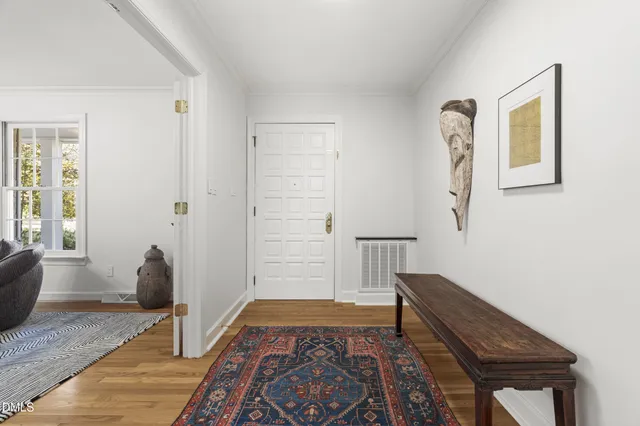 a living room with furniture and a lamp