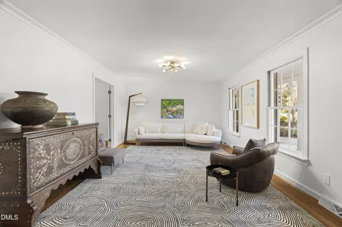 a view of a dining room with furniture and wooden floor