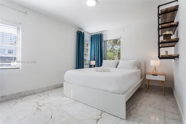 a bedroom with a bed and a cabinets