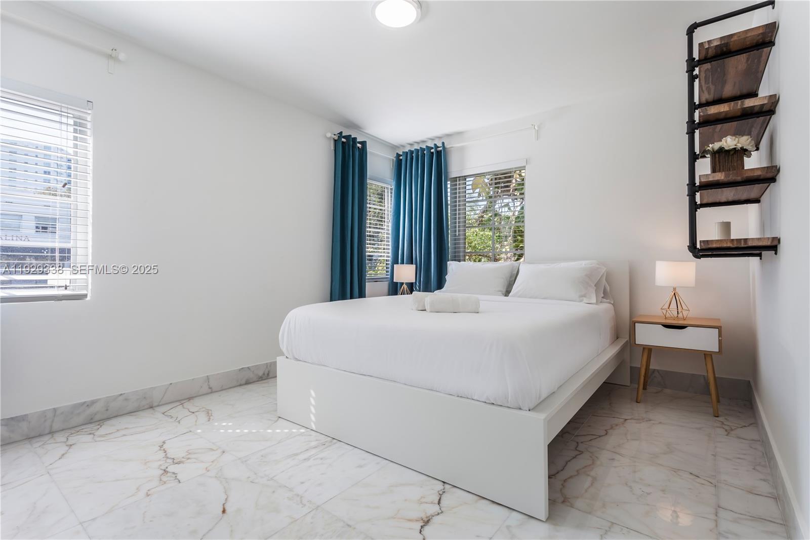 807 Alton Road Miami Beach, FL 33139 - Photo 7 of 7 a bedroom with a bed and a cabinets