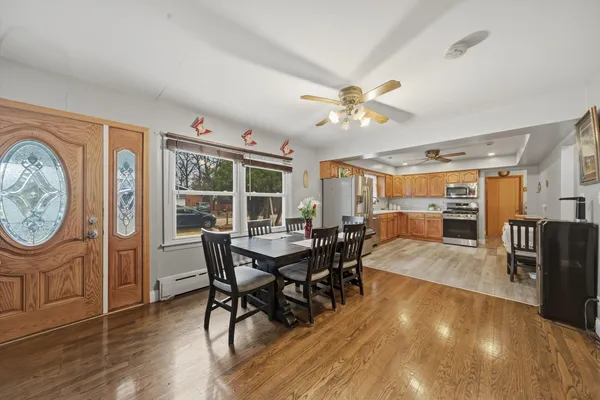 a view of a dining room with furniture window and wooden floor