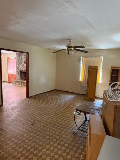 9800 North County Road Frisco, TX 75033 - Photo 4 of 14 Living room featuring a textured ceiling and a ceiling fan