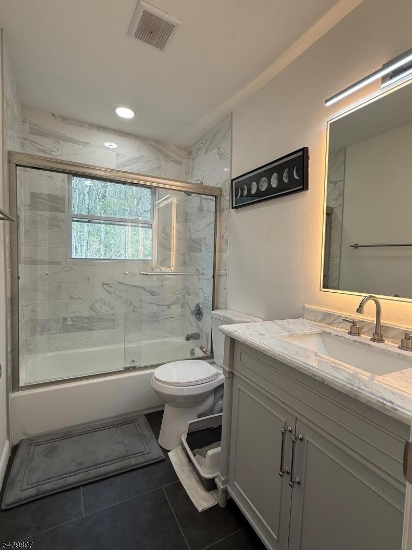 22 Karen Road Vernon, NJ 07422 - Photo 20 of 26 a bathroom with a double vanity sink toilet and shower