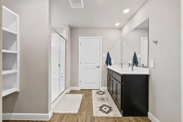 a bathroom with a sink and a mirror