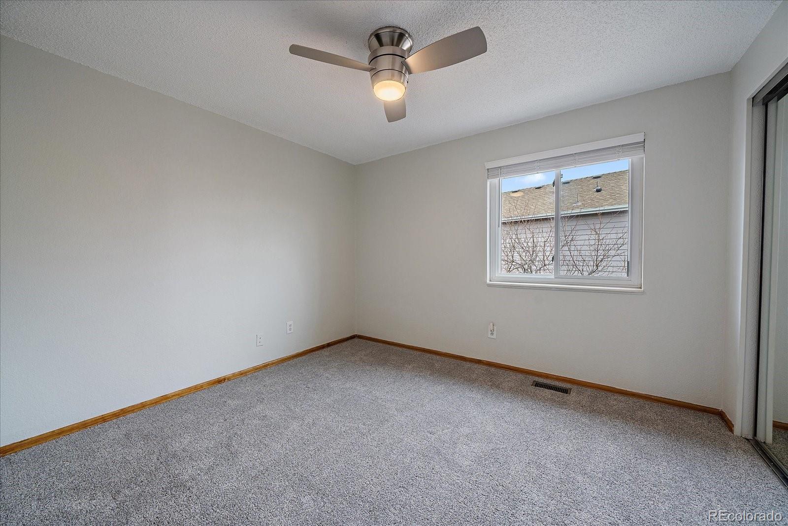 10961 Gray Circle Westminster, CO 80020 - Photo 19 of 24 an empty room with a window