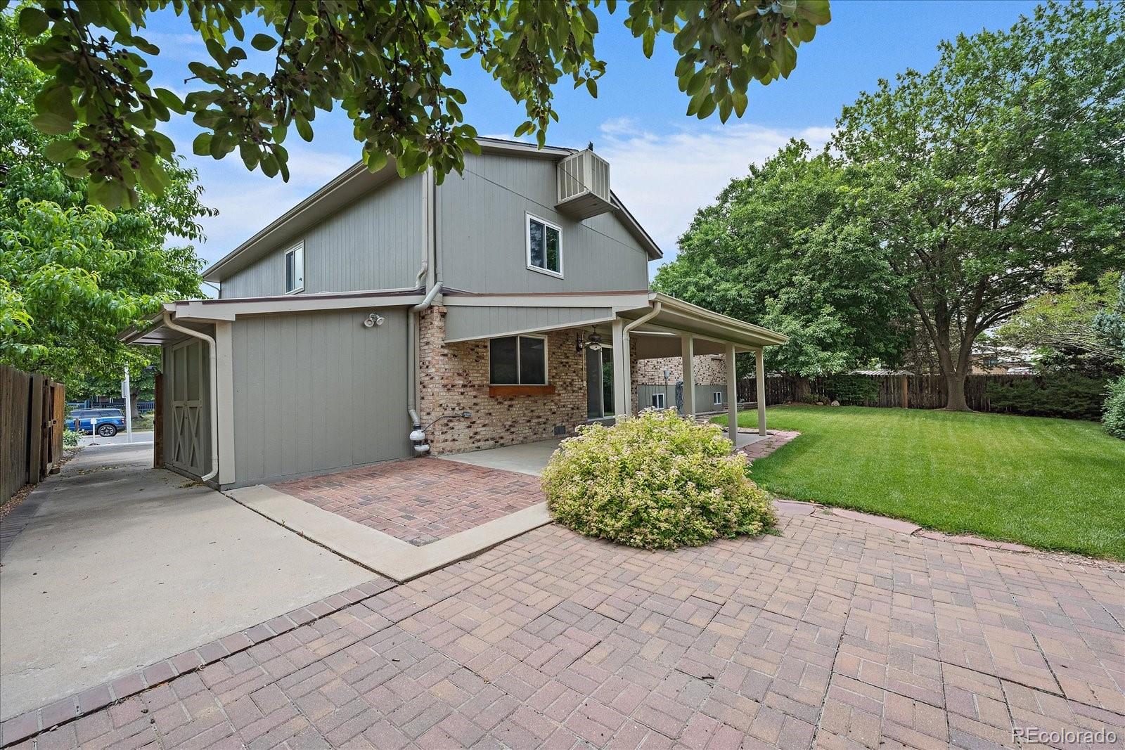 10961 Gray Circle Westminster, CO 80020 - Photo 22 of 24 a view of house with a yard