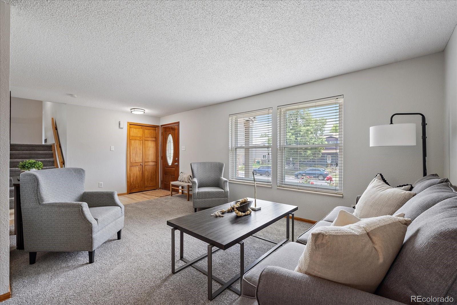 10961 Gray Circle Westminster, CO 80020 - Photo 3 of 24 a living room with furniture and a window