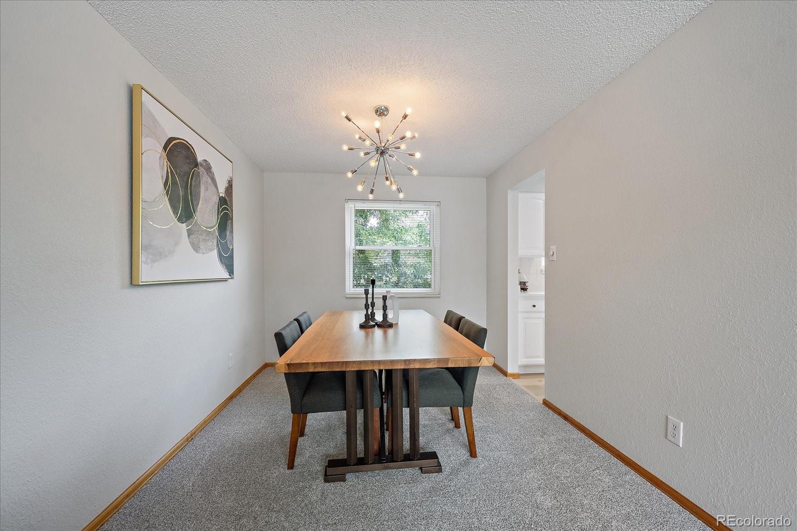 10961 Gray Circle Westminster, CO 80020 - Photo 4 of 24 a dining room with furniture and window