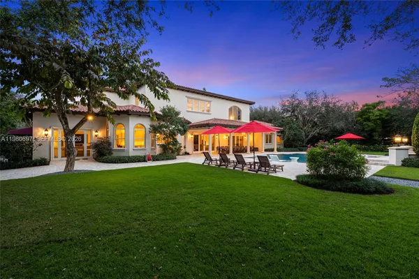 a view of a house with a yard porch and sitting area