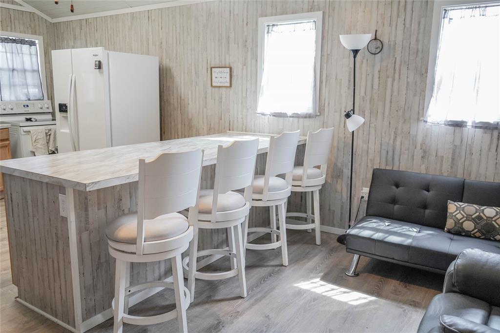 386 North Rock Creek Road Waco, TX 76708 - Photo 12 of 40 a living room with furniture a fireplace and a table