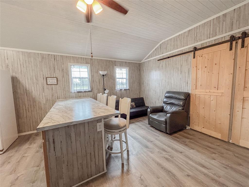 386 North Rock Creek Road Waco, TX 76708 - Photo 17 of 40 a living room with furniture a chandelier and a window