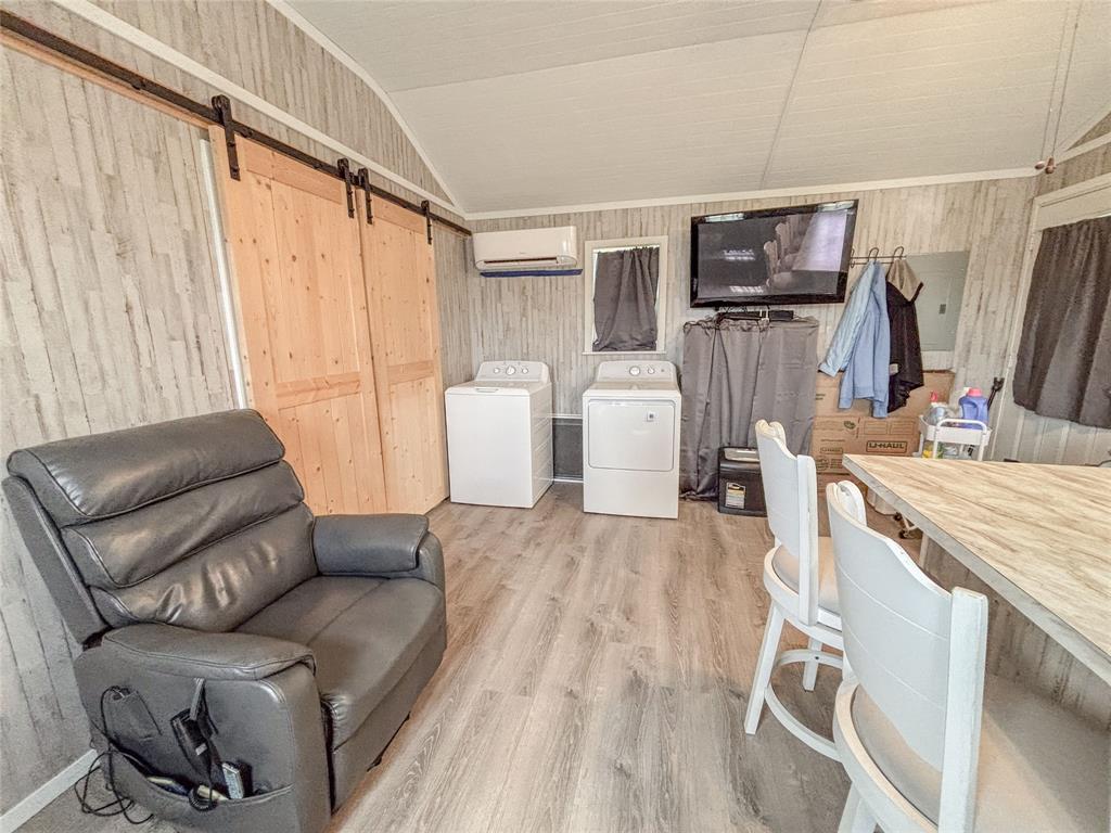 386 North Rock Creek Road Waco, TX 76708 - Photo 18 of 40 a living room with furniture and a flat screen tv