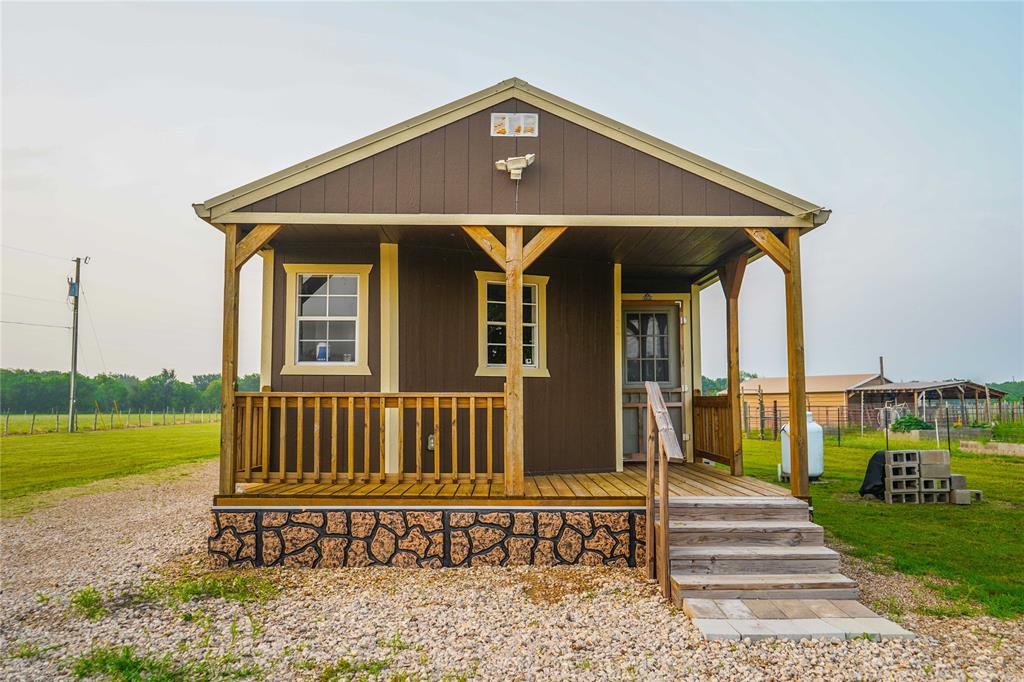 386 North Rock Creek Road Waco, TX 76708 - Photo 2 of 40 a front view of a house with garden