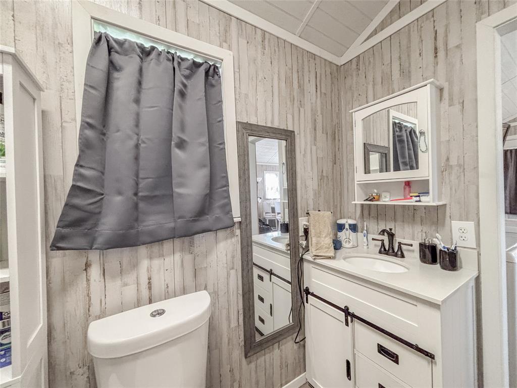 386 North Rock Creek Road Waco, TX 76708 - Photo 21 of 40 a bathroom with a sink a toilet and shower