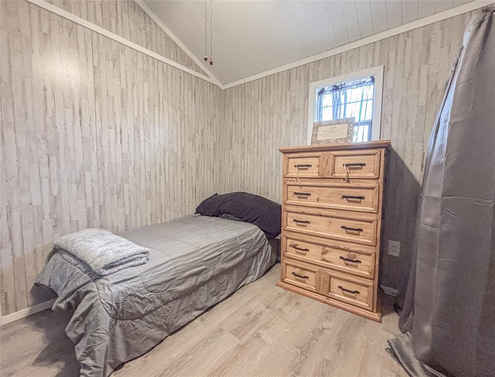 386 North Rock Creek Road Waco, TX 76708 - Photo 23 of 40 a bedroom with a bed and a window