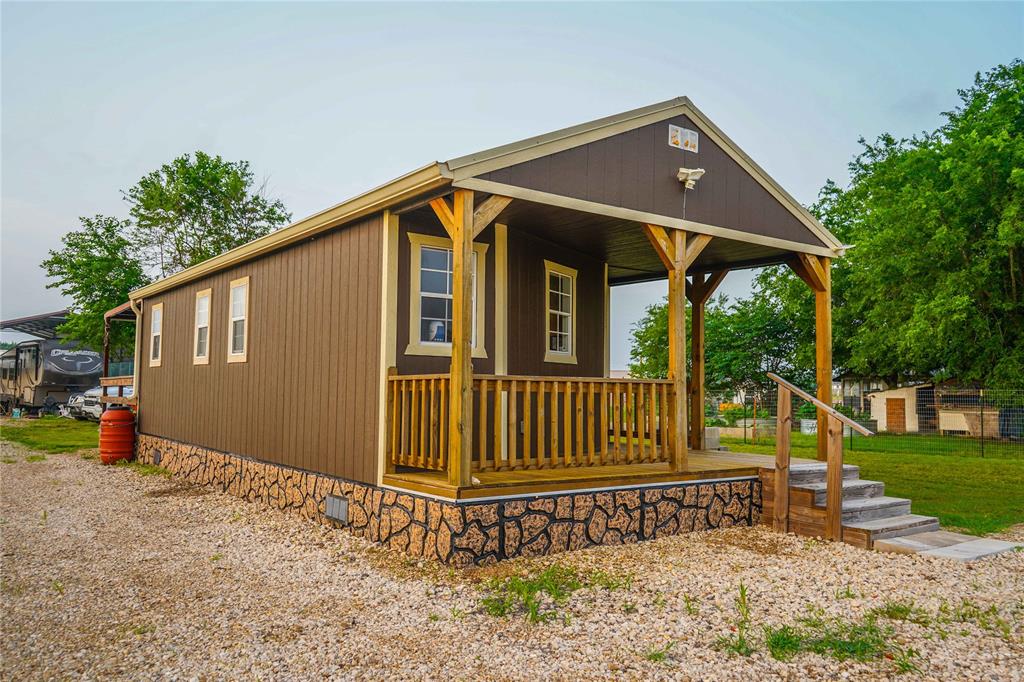 386 North Rock Creek Road Waco, TX 76708 - Photo 3 of 40 a view of an house with backyard and sitting area