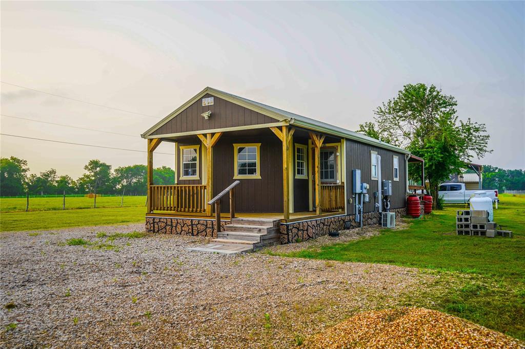 386 North Rock Creek Road Waco, TX 76708 - Photo 4 of 40 a view of a house with backyard porch and sitting area