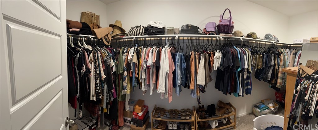5895 Nectar Drive Banning, CA 92220 - Photo 15 of 29 a view of walk in closet with clothes and shoes