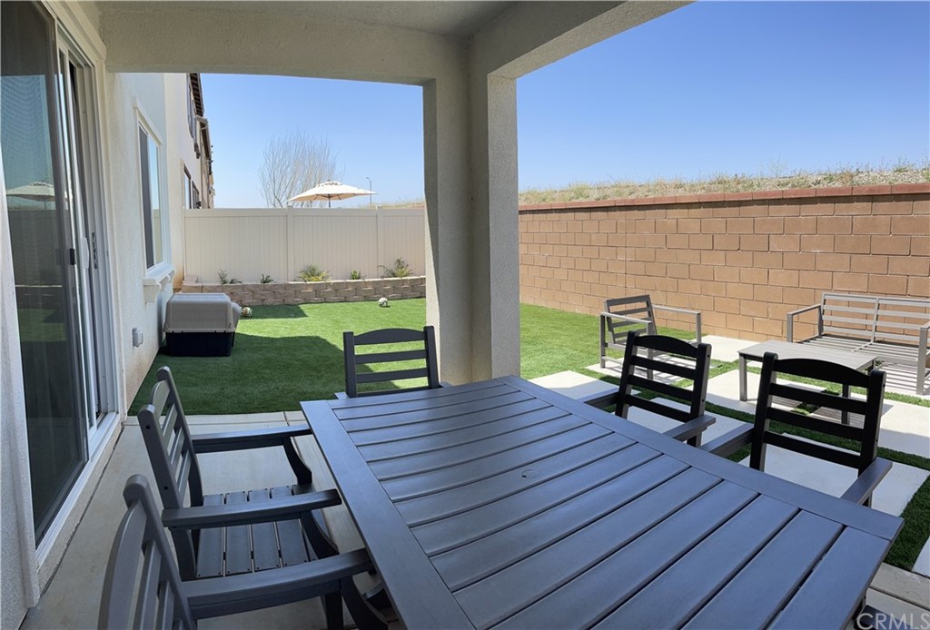 5895 Nectar Drive Banning, CA 92220 - Photo 18 of 29 a view of a deck with wooden floor and outdoor seating
