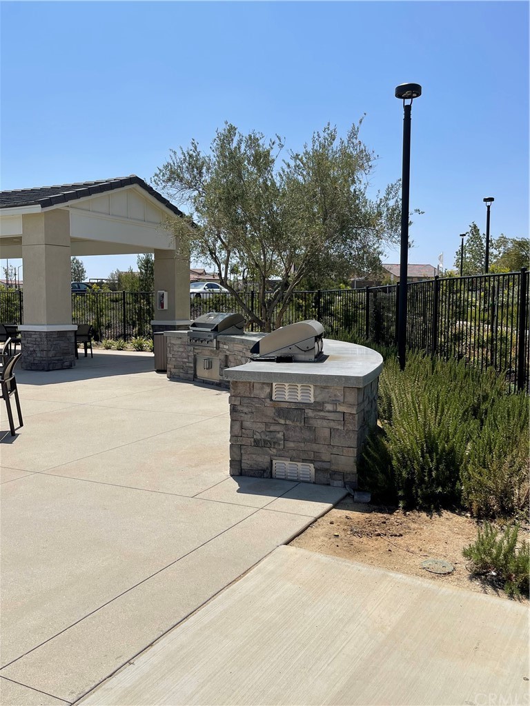 5895 Nectar Drive Banning, CA 92220 - Photo 22 of 29 a view of a terrace with couches and wooden fence
