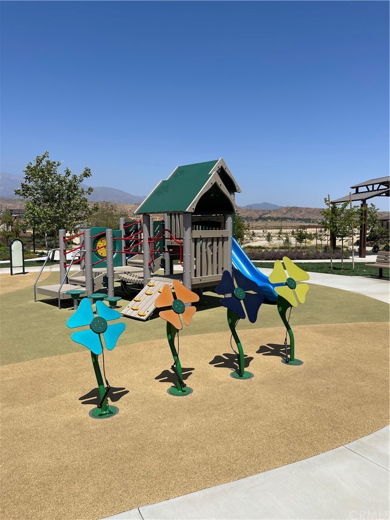 5895 Nectar Drive Banning, CA 92220 - Photo 28 of 29 a view of a swimming pool with a bench and fire pit