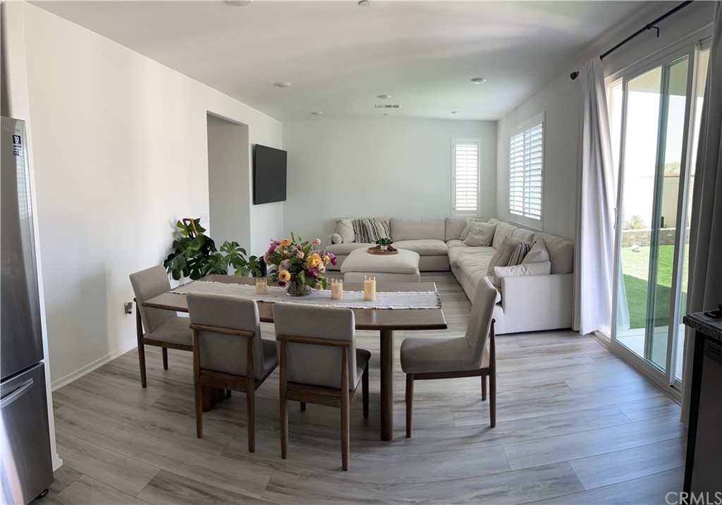 5895 Nectar Drive Banning, CA 92220 - Photo 5 of 29 a view of a dining room with furniture and wooden floor