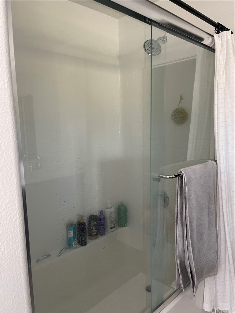 5895 Nectar Drive Banning, CA 92220 - Photo 10 of 29 a bathroom with a glass shower door