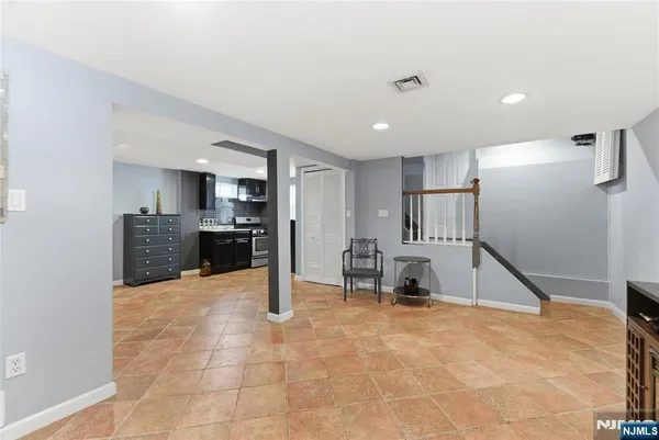 a view of kitchen with refrigerator sink and stove
