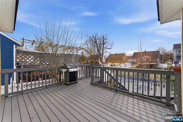 a view of a balcony with wooden floor