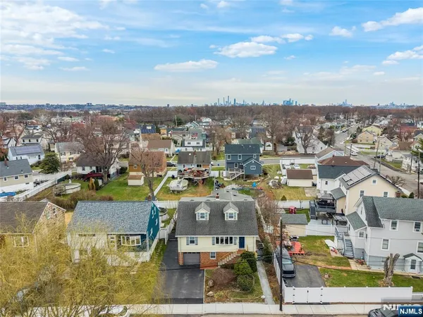 an aerial view of residential house with outdoor space and swimming pool