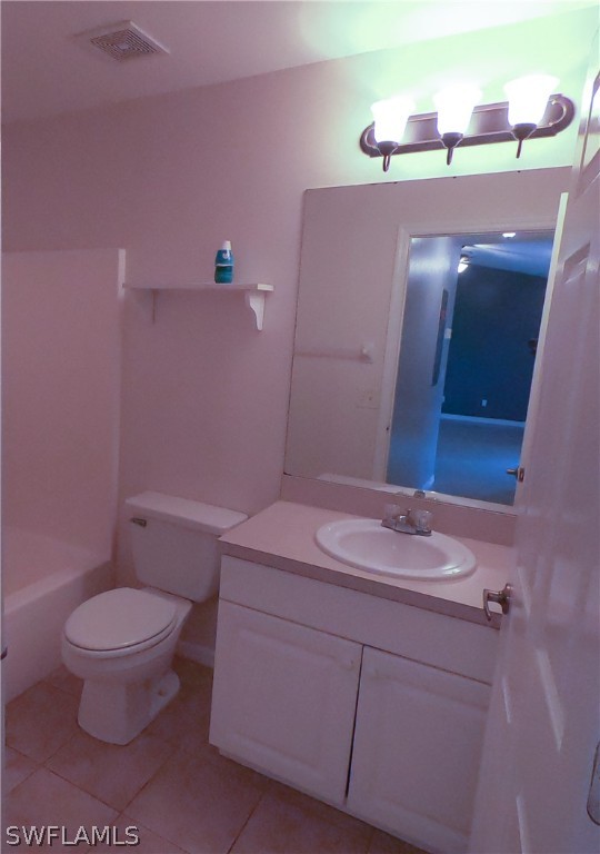 4631 29th Street Southwest Lehigh Acres, FL 33973 - Photo 2 of 10 a bathroom with a sink a toilet and a mirror
