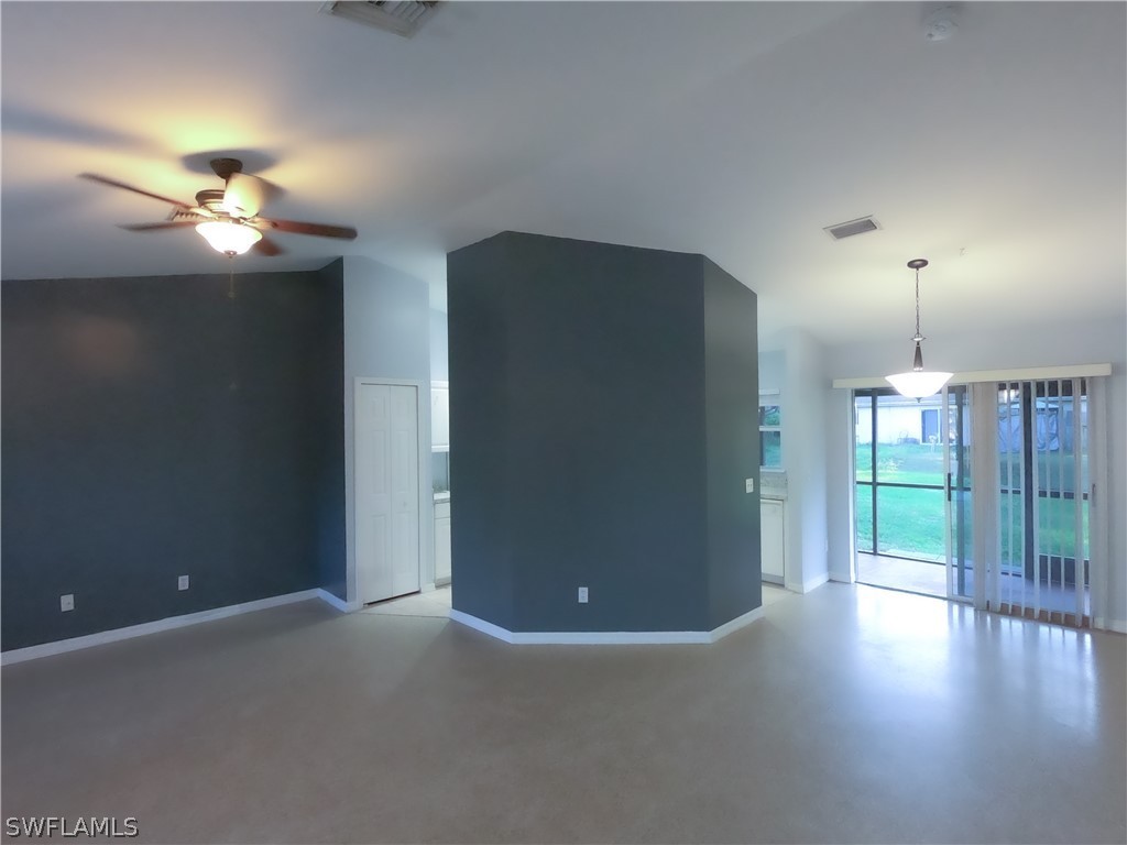 4631 29th Street Southwest Lehigh Acres, FL 33973 - Photo 5 of 10 a view of empty room with wooden floor