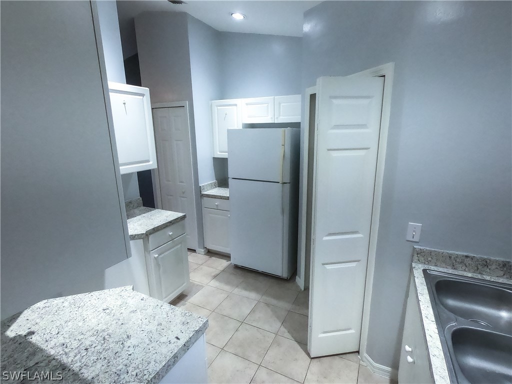 4631 29th Street Southwest Lehigh Acres, FL 33973 - Photo 6 of 10 a bathroom with a sink toilet and shower