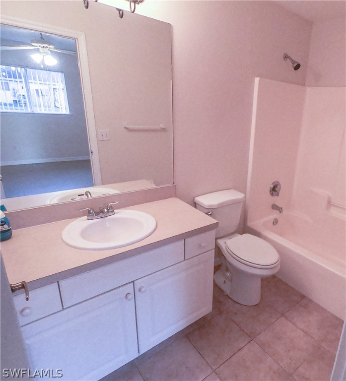 4631 29th Street Southwest Lehigh Acres, FL 33973 - Photo 8 of 10 a bathroom with a sink a toilet and shower