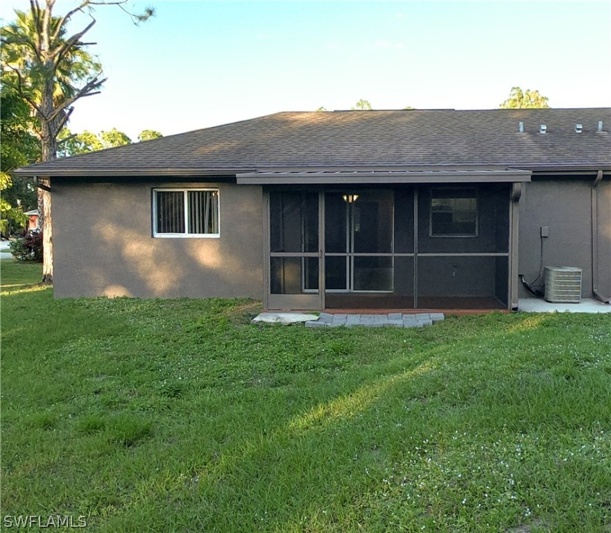 4631 29th Street Southwest Lehigh Acres, FL 33973 - Photo 10 of 10 a front view of a house with a yard
