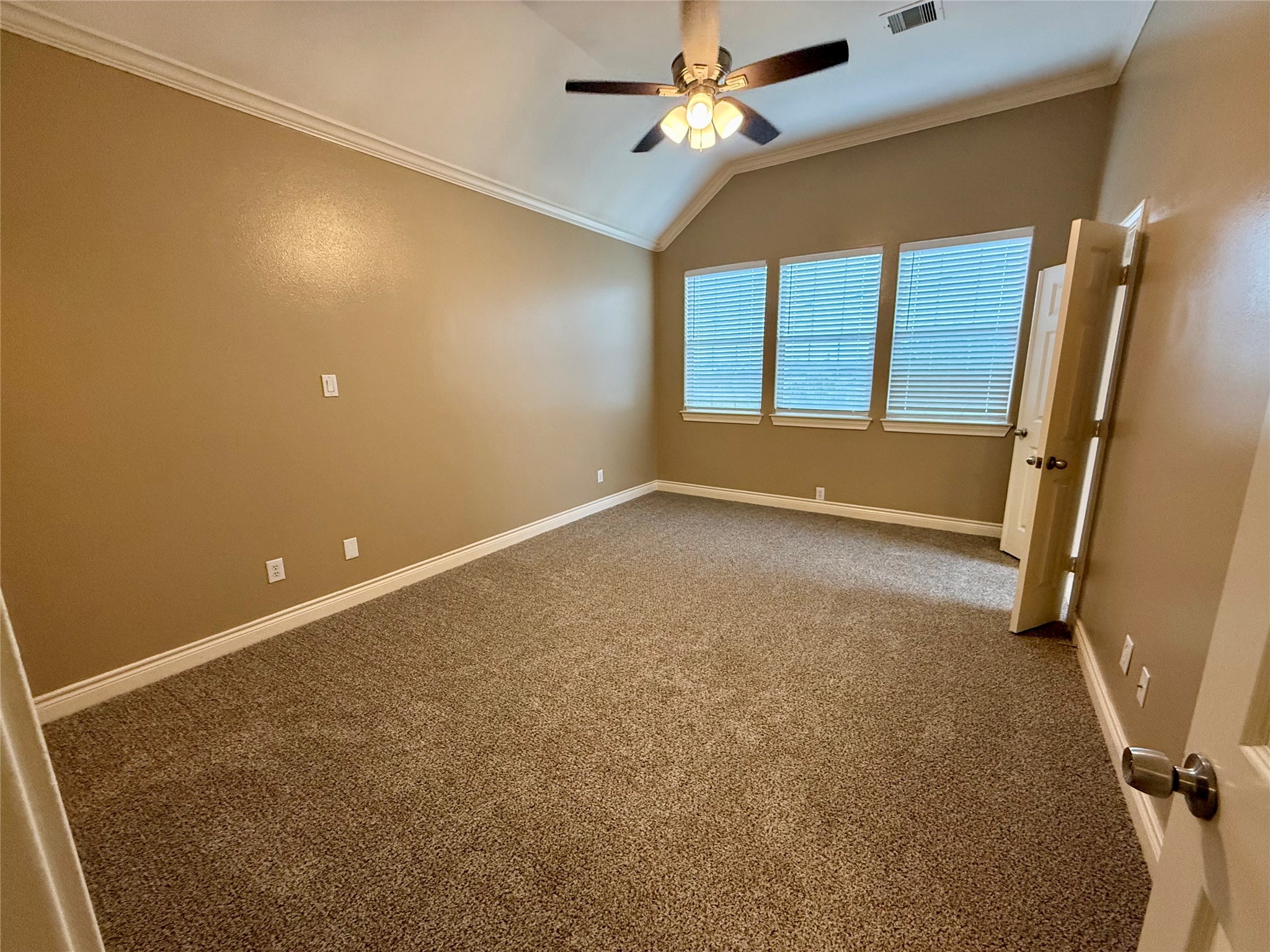 3540 Cline Street Houston, TX 77020 - Photo 11 of 26 Digitally Enhanced: Primary bedroom retreat featuring 2 spacious closets, plush carpeting, ceiling fan, and large windows.