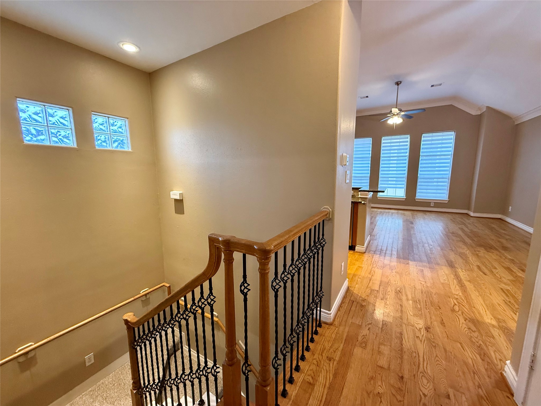 3540 Cline Street Houston, TX 77020 - Photo 10 of 26 Upper-level landing featuring a handsome wood-railing staircase.