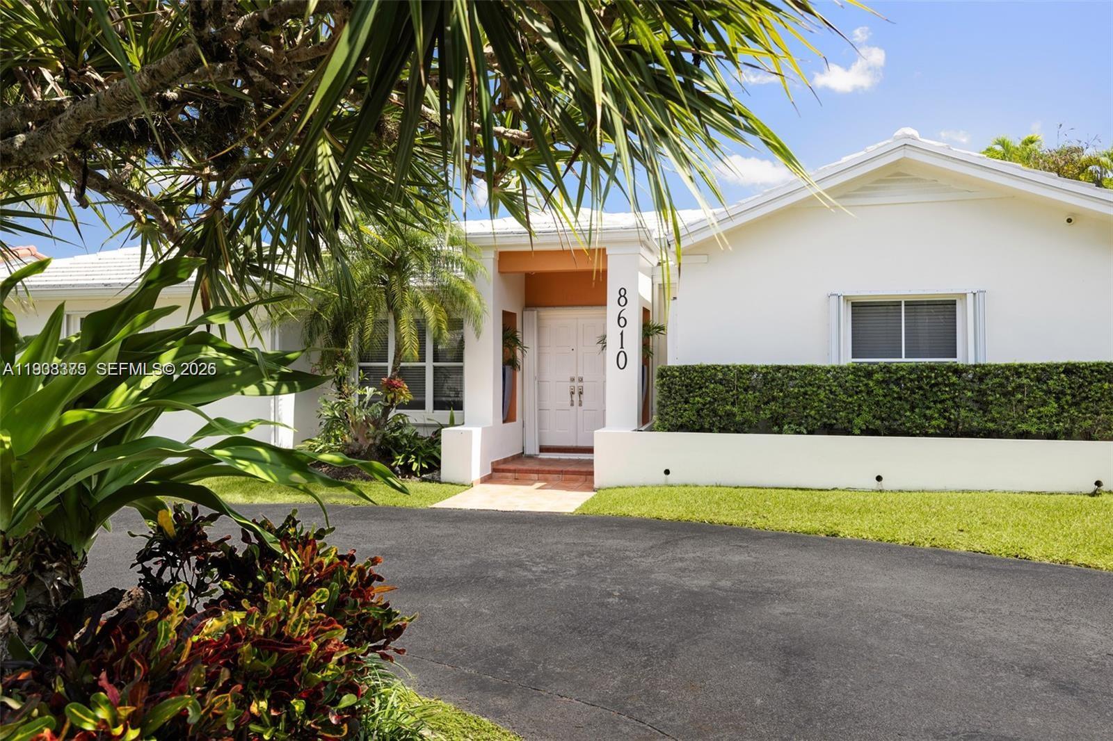 8610 Southwest 83rd Street Miami, FL 33143 - Photo 4 of 45 a view of an house with backyard and swimming pool