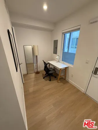 a view of a livingroom with furniture and wooden floor