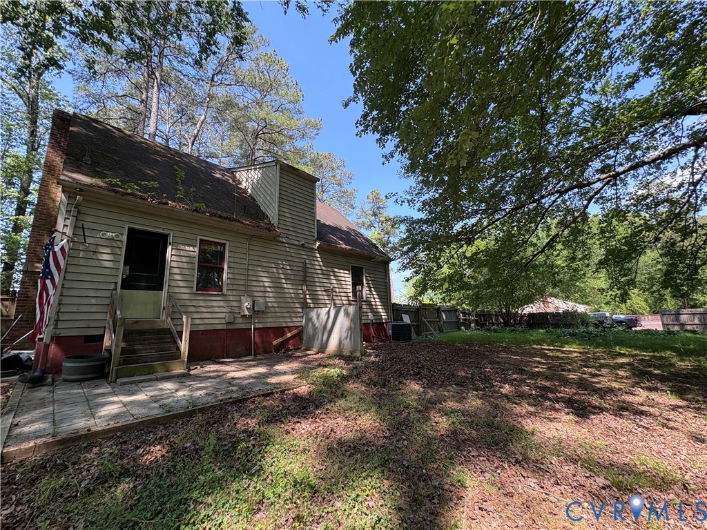 1291 Grapevine Road Sandston, VA 23150 - Photo 18 of 25 Back of house showing privacy fencing and paver pa