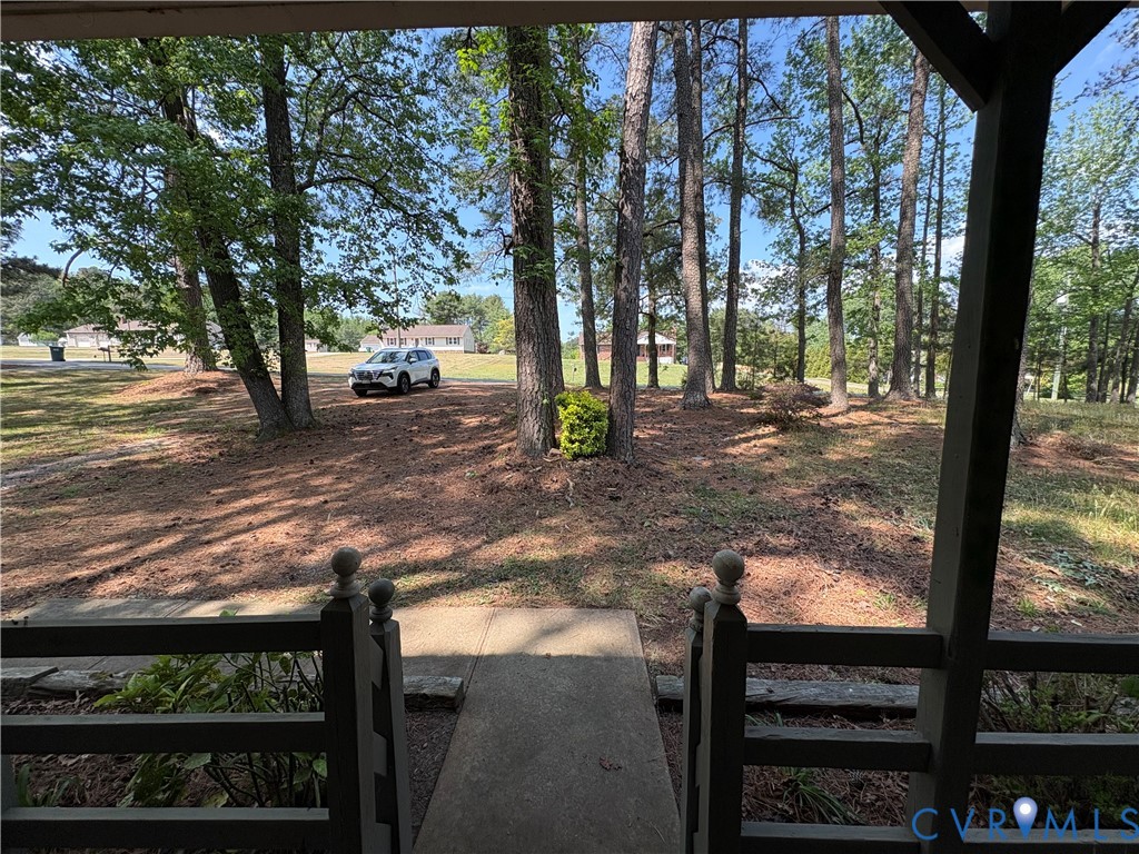 1291 Grapevine Road Sandston, VA 23150 - Photo 25 of 25 The front yard is wooded and shady.