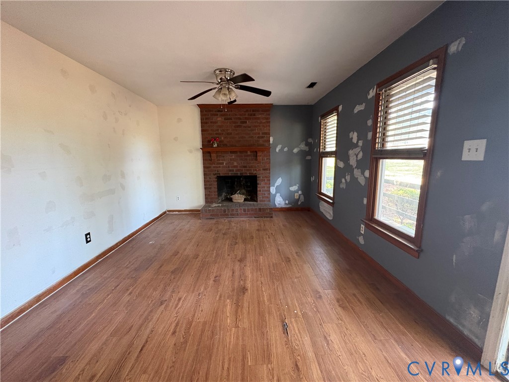 1291 Grapevine Road Sandston, VA 23150 - Photo 5 of 25 Has a fireplace, ceiling fan and lvp floors