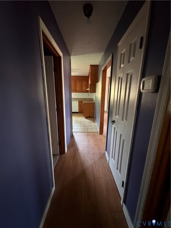 1291 Grapevine Road Sandston, VA 23150 - Photo 10 of 25 Downstairs hall with pantry and linen closet.